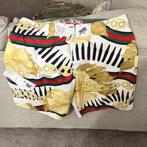 Billabong White Swim Trunks with Gold Floral & Black/Green/Red Stripes